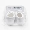 New Baby Kojenecké capáčky s mašličkou bílá 12-18 m