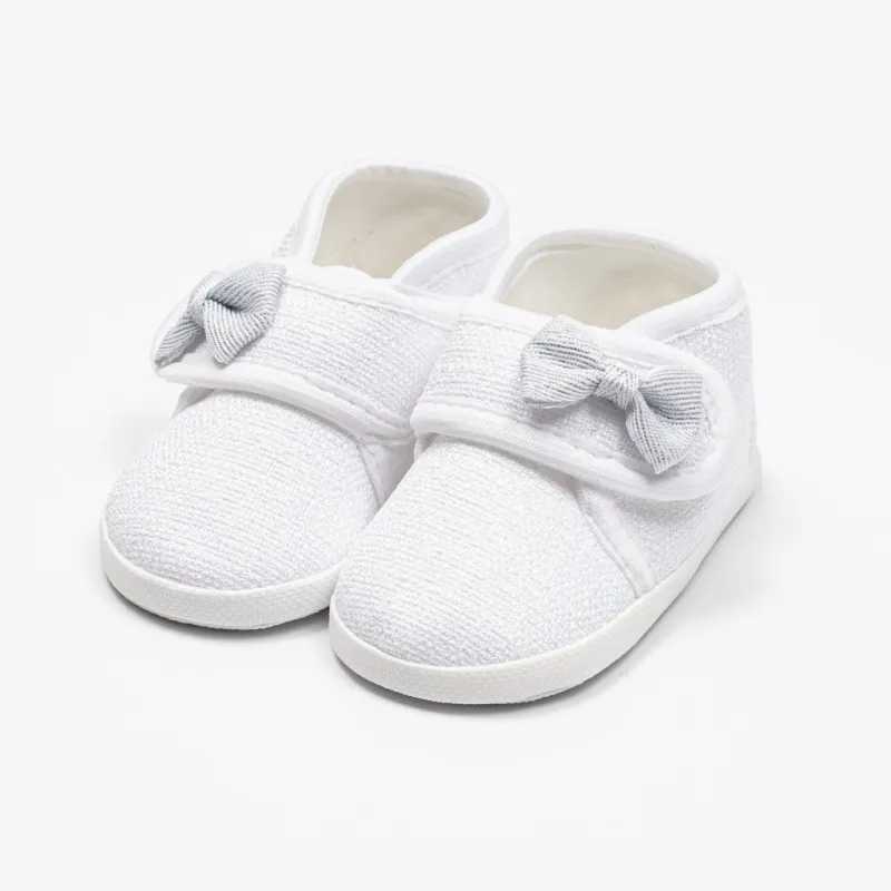 New Baby Kojenecké capáčky s mašličkou bílá 12-18 m