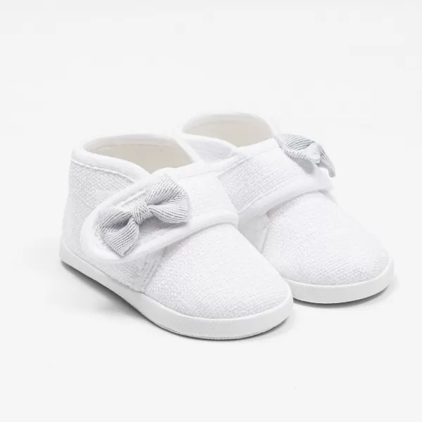 New Baby Kojenecké capáčky s mašličkou bílá 0-3 m